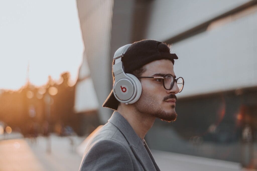 Streaming Audio Trends. shallow focus photography of man wearing Beats wireless headphones