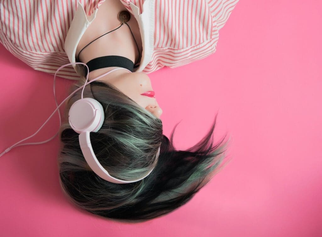 Streaming Audio Trends. woman covering her hair and wearing headphones